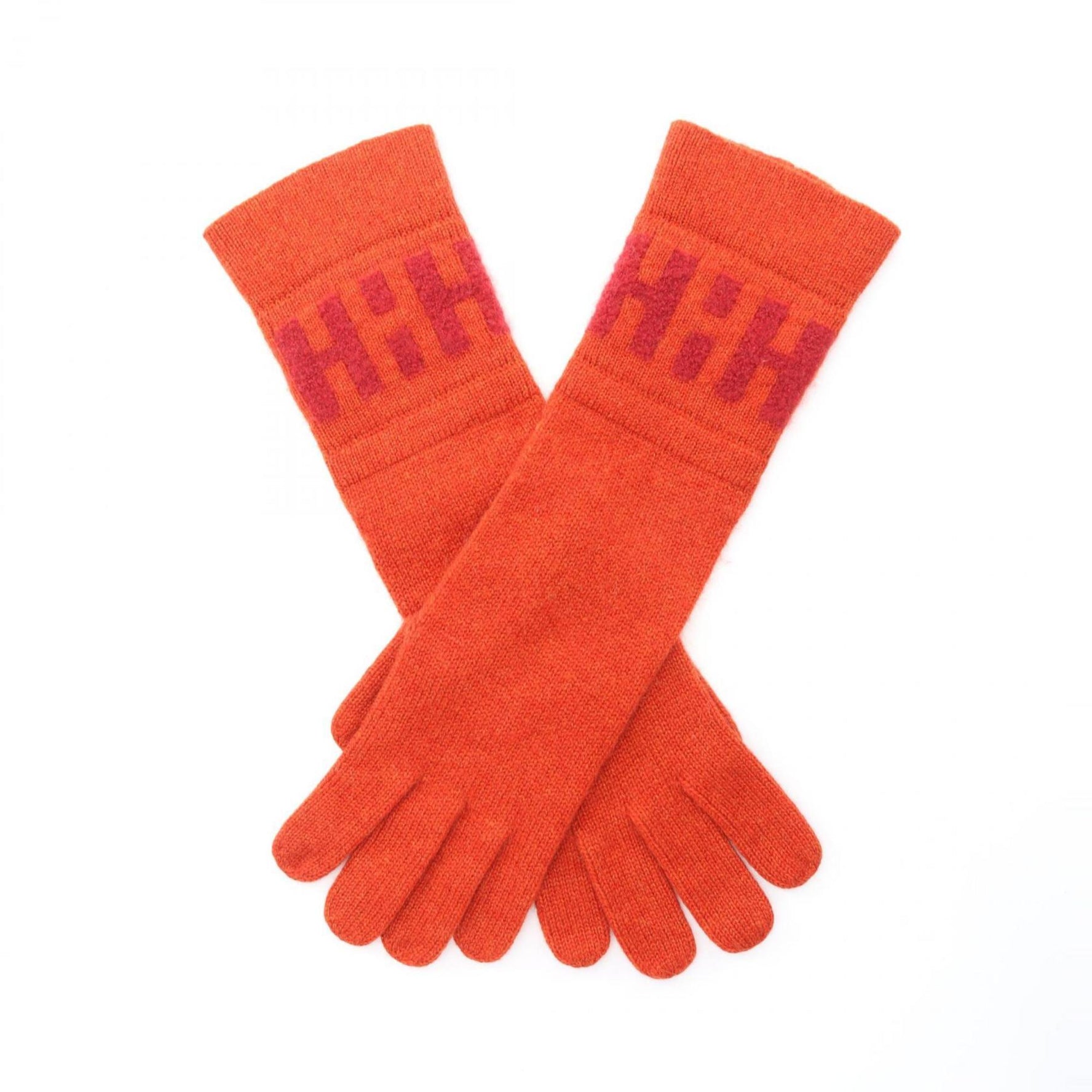 Hermes cashmere gloves in orange.