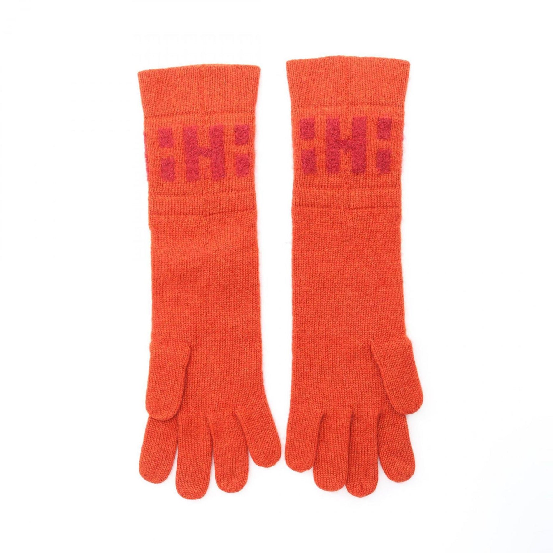 Hermes cashmere gloves in orange.
