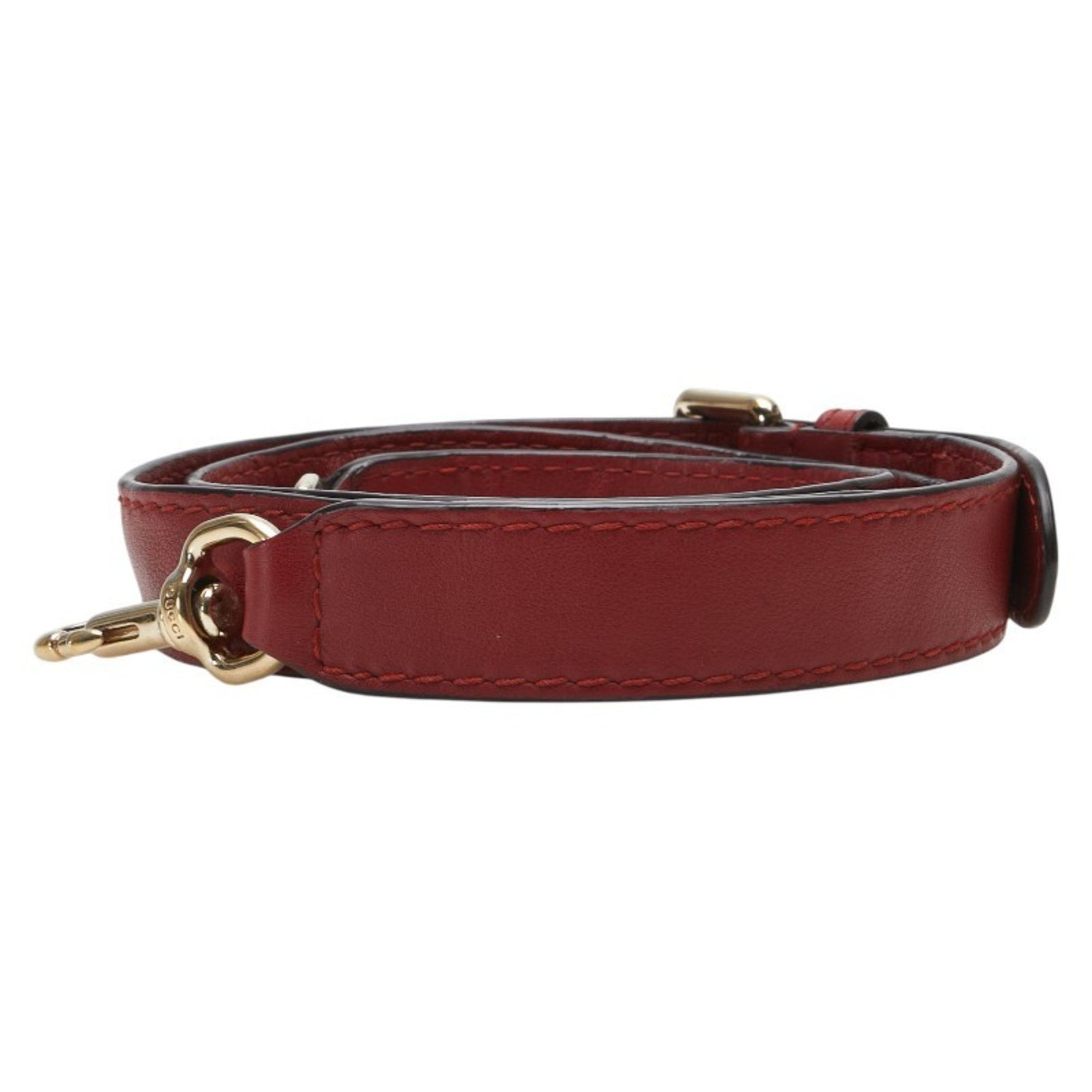 Gucci shoulder strap in red and gold plated leather .