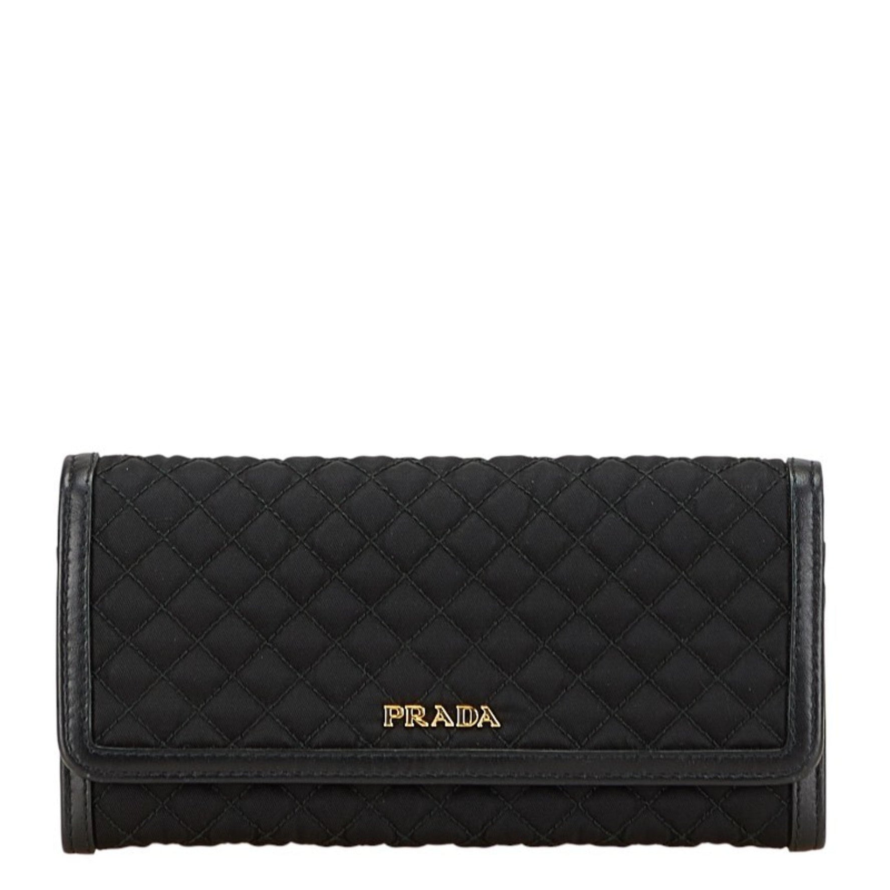 Prada quilted long wallet in nylon and leather .