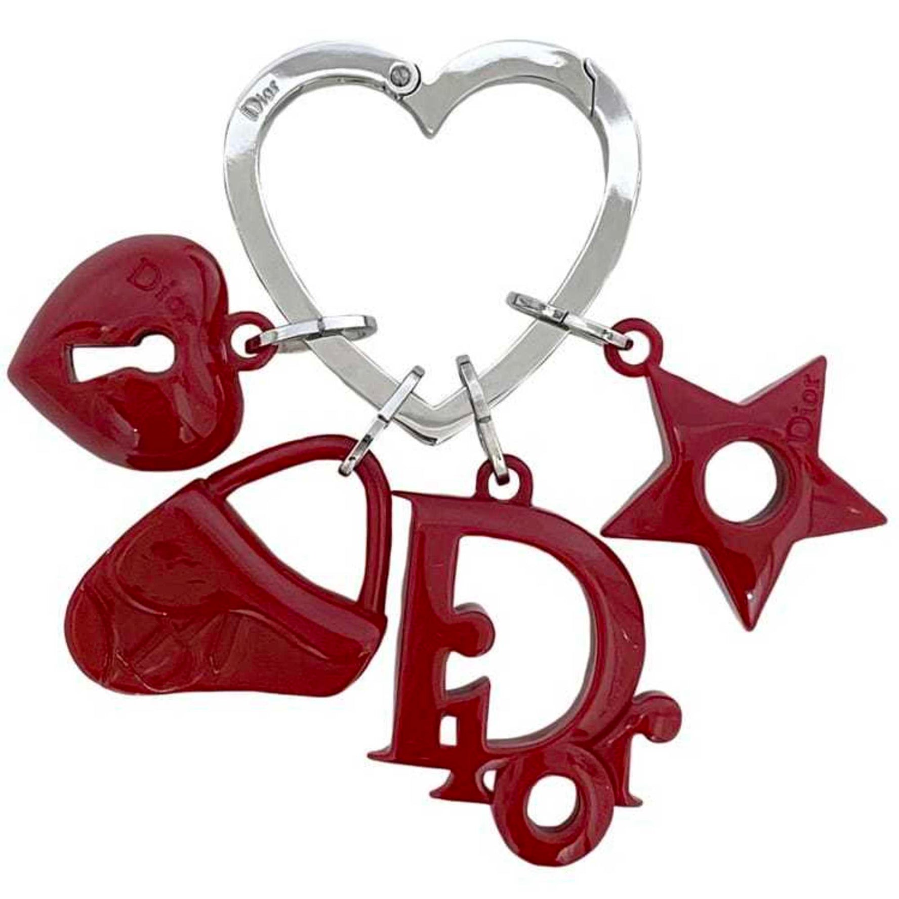 Christian Dior Key Ring in red, silver, plastic, and metal. Features a heart star motif, perfect for saddlebags. Also available: bag charm with carabiner.