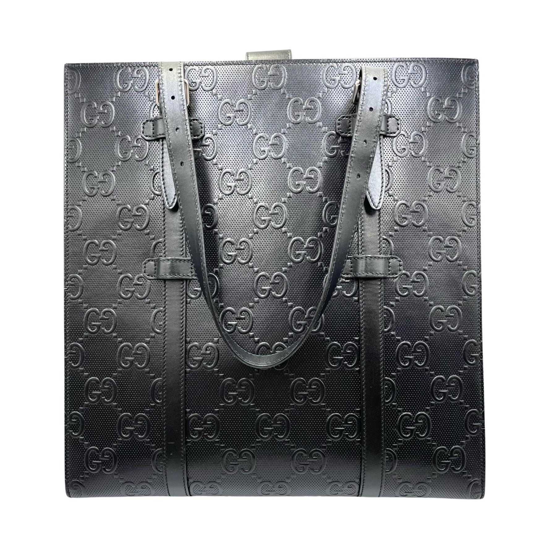 Gucci GG embossed perforated leather handbag in
