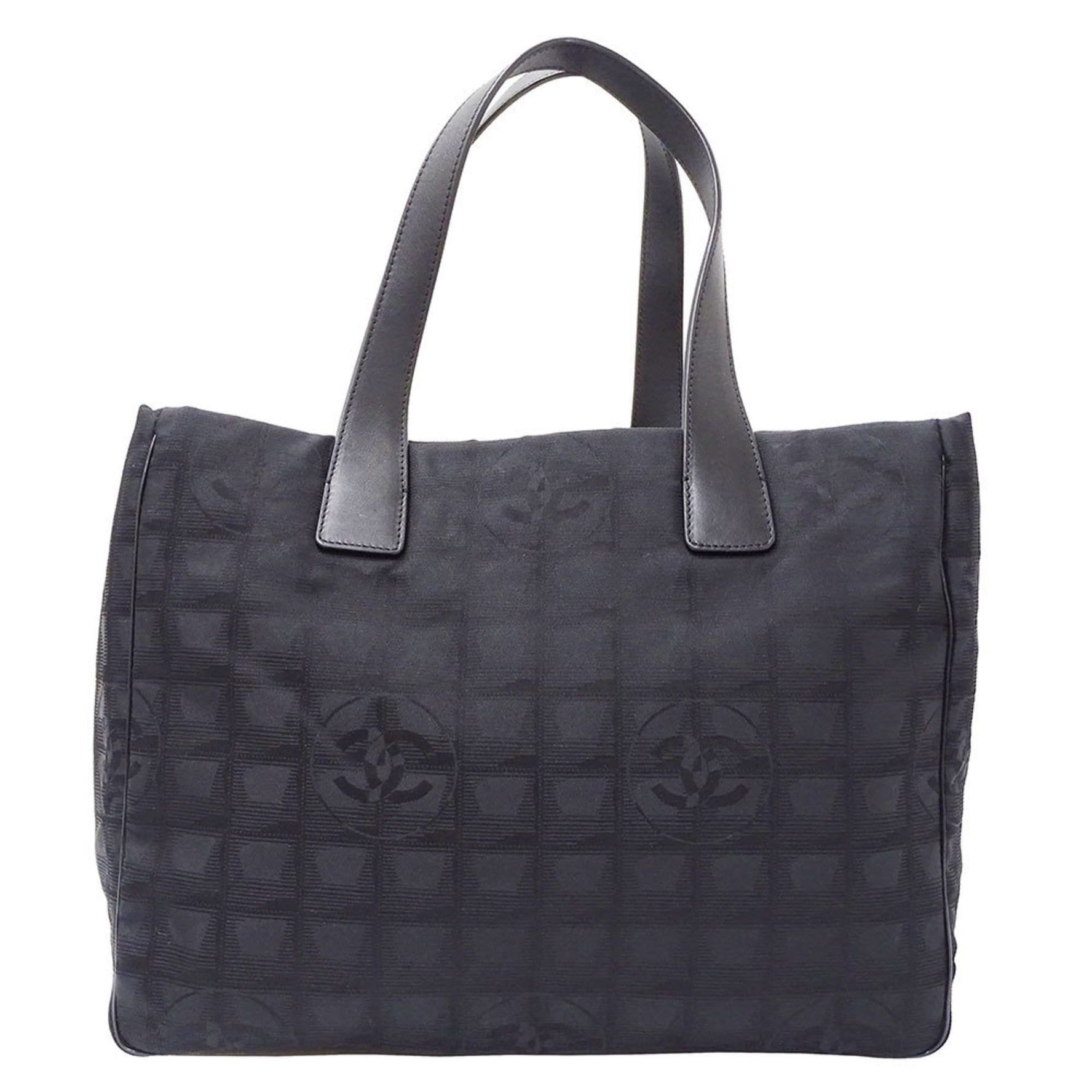 Chanel New Travel Tote MM in a nylon tote bag .