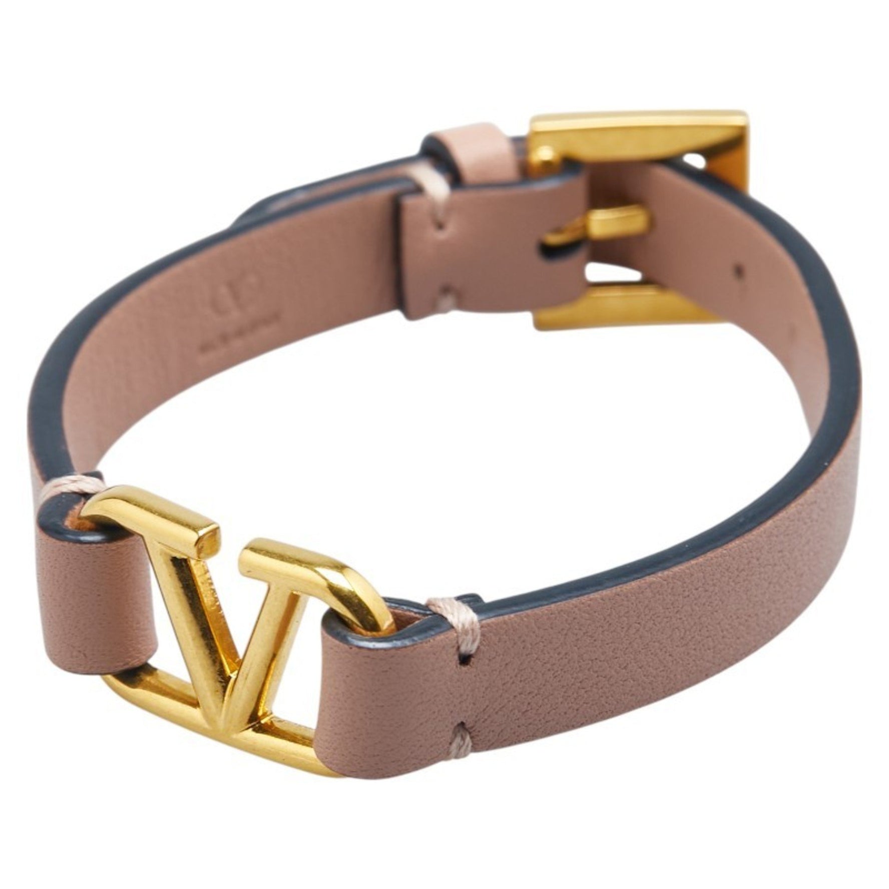 Valentino Garavani logo belt bracelet in beige and pink leather .