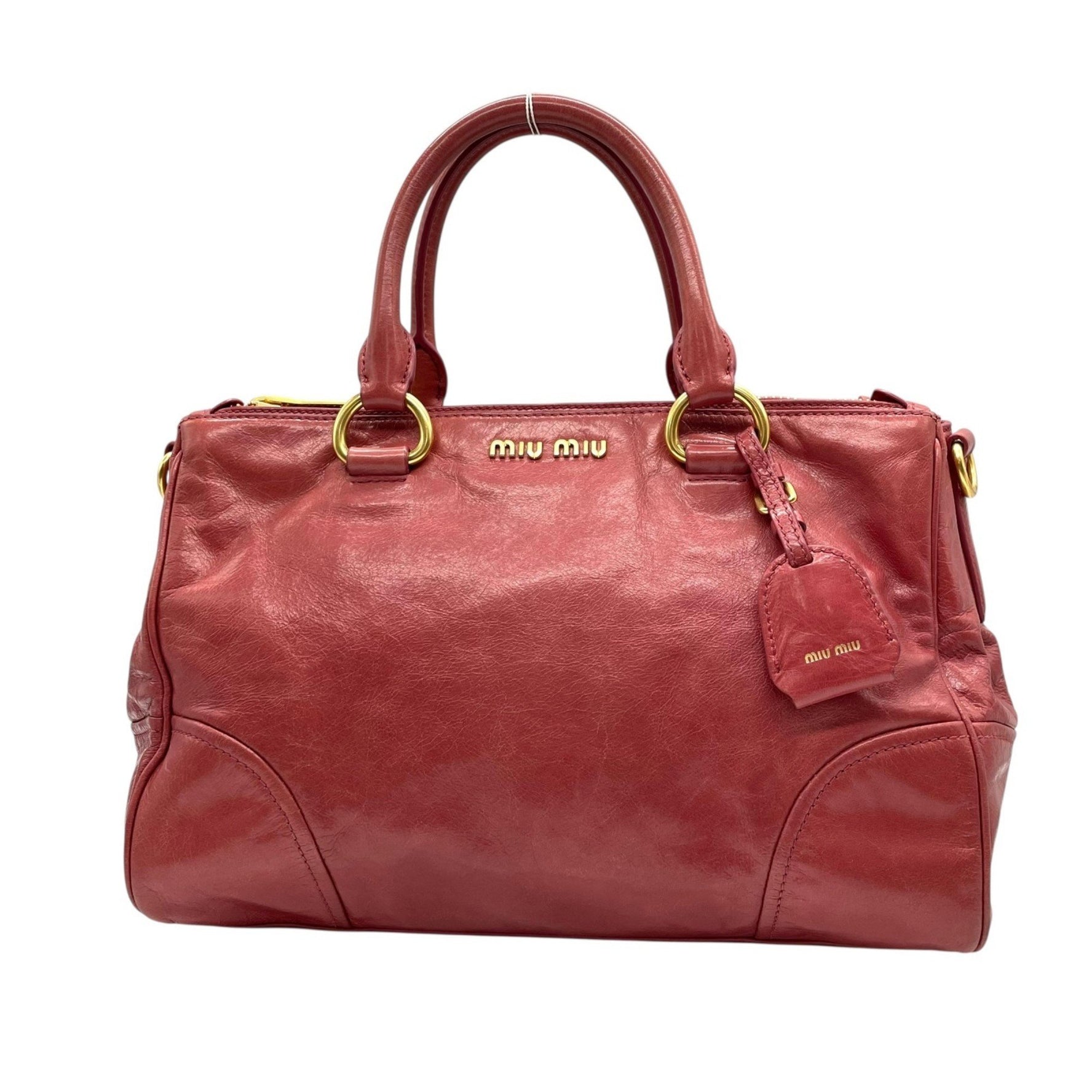 Miu Miu Miu VITELLO SHINE Red Tote Bag a leather handbag and tote bag.