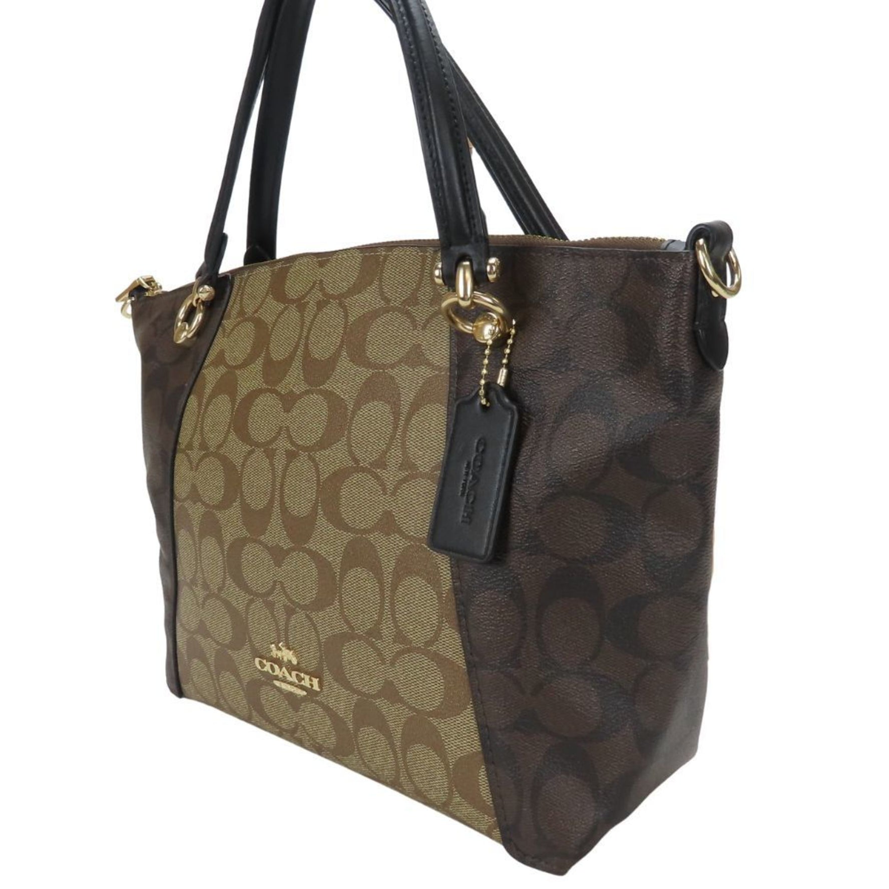 Coach handbag Signature coated canvas and leather shoulder bag in beige, brown, black.