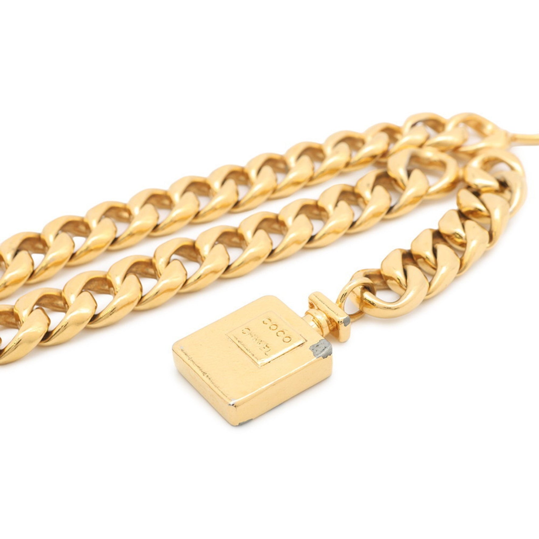 Chanel chain belt with perfume motif.