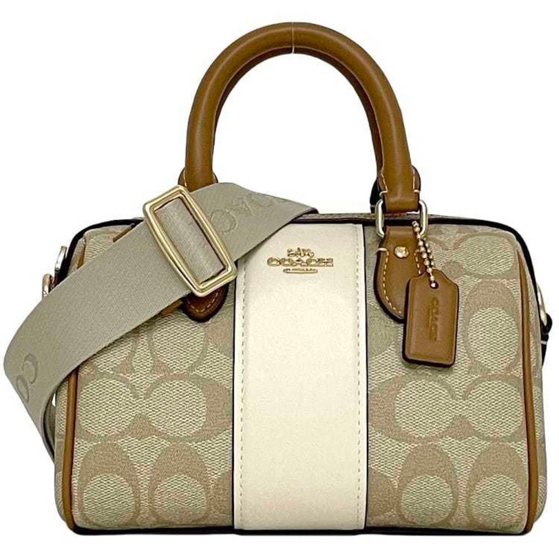 Coach Aaron Bag in Beige, Camel Brown, and Signature PVC Leather. This mini Boston bag features a strap white crossbody strap.