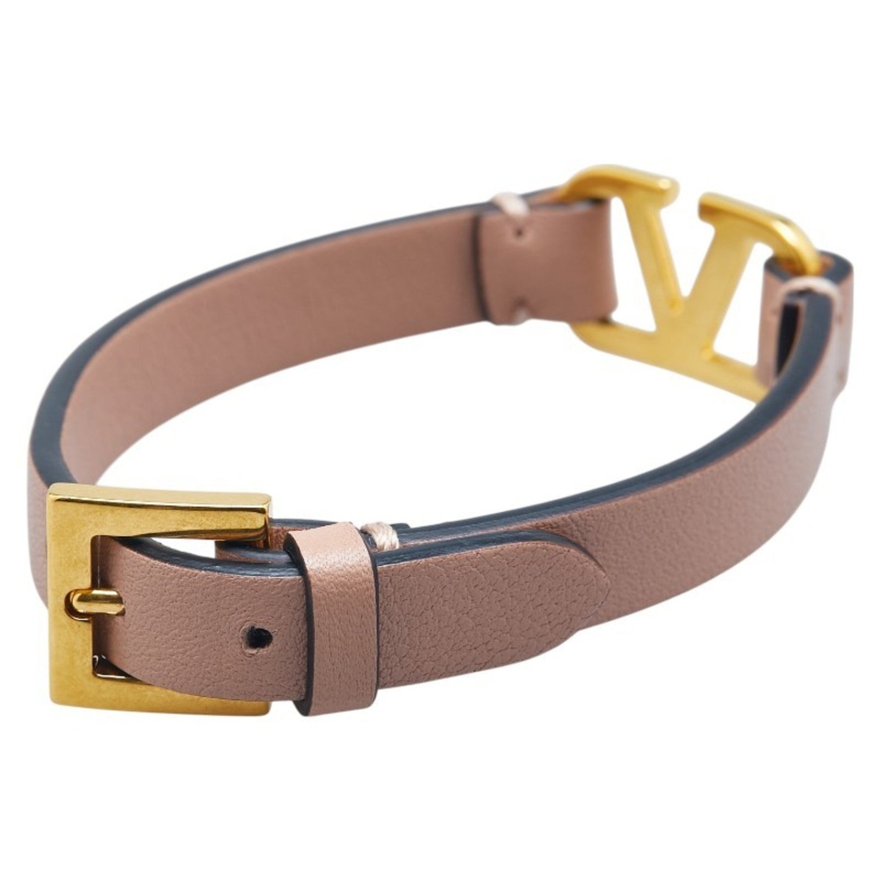 Valentino Garavani logo belt bracelet in beige and pink leather .