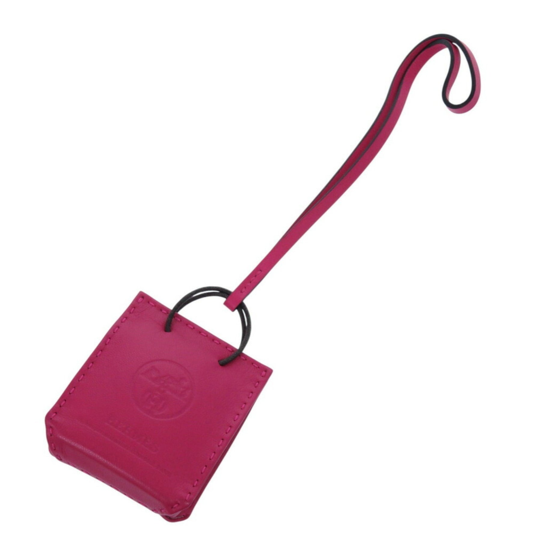 Like new Hermès Sac Orange bag charm in lambskin with a Y stamp and keychain.