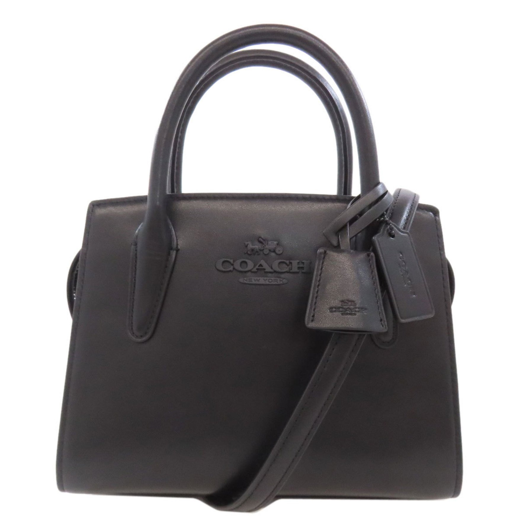 Coach and Carryall handbag in calfskin .