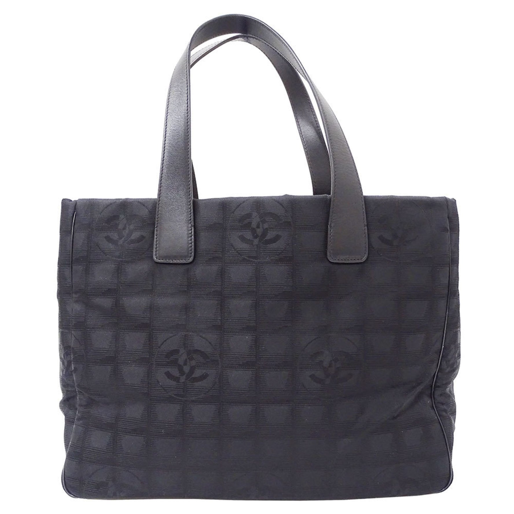 Chanel New Travel Tote MM in a nylon tote bag .