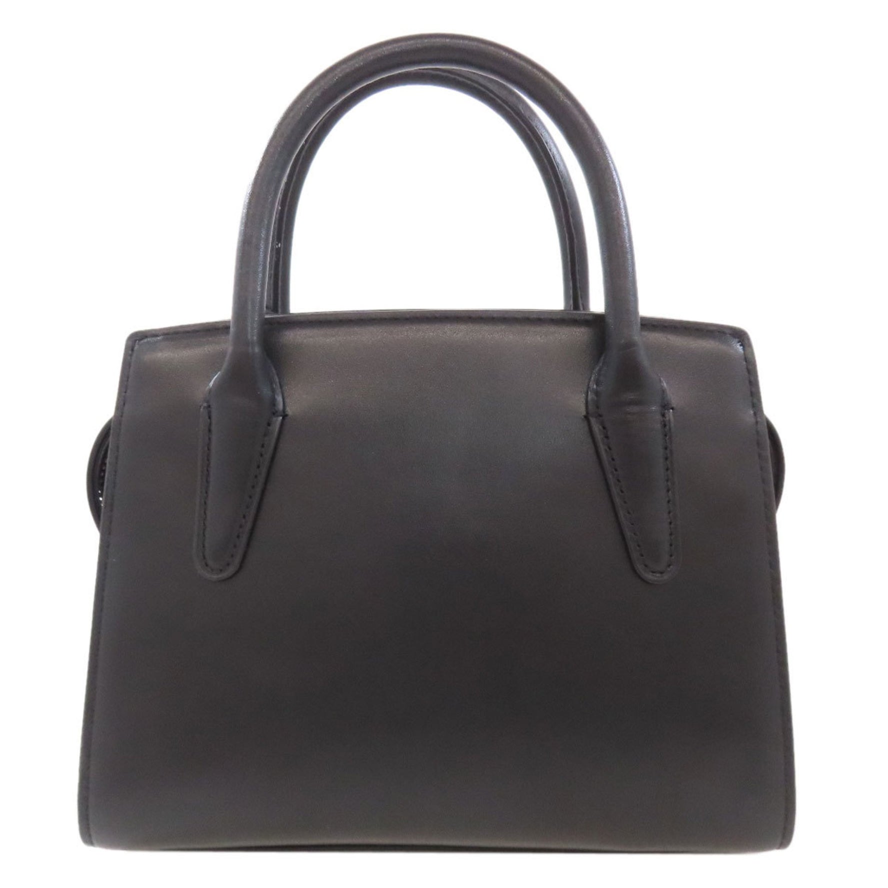 Coach and Carryall handbag in calfskin .