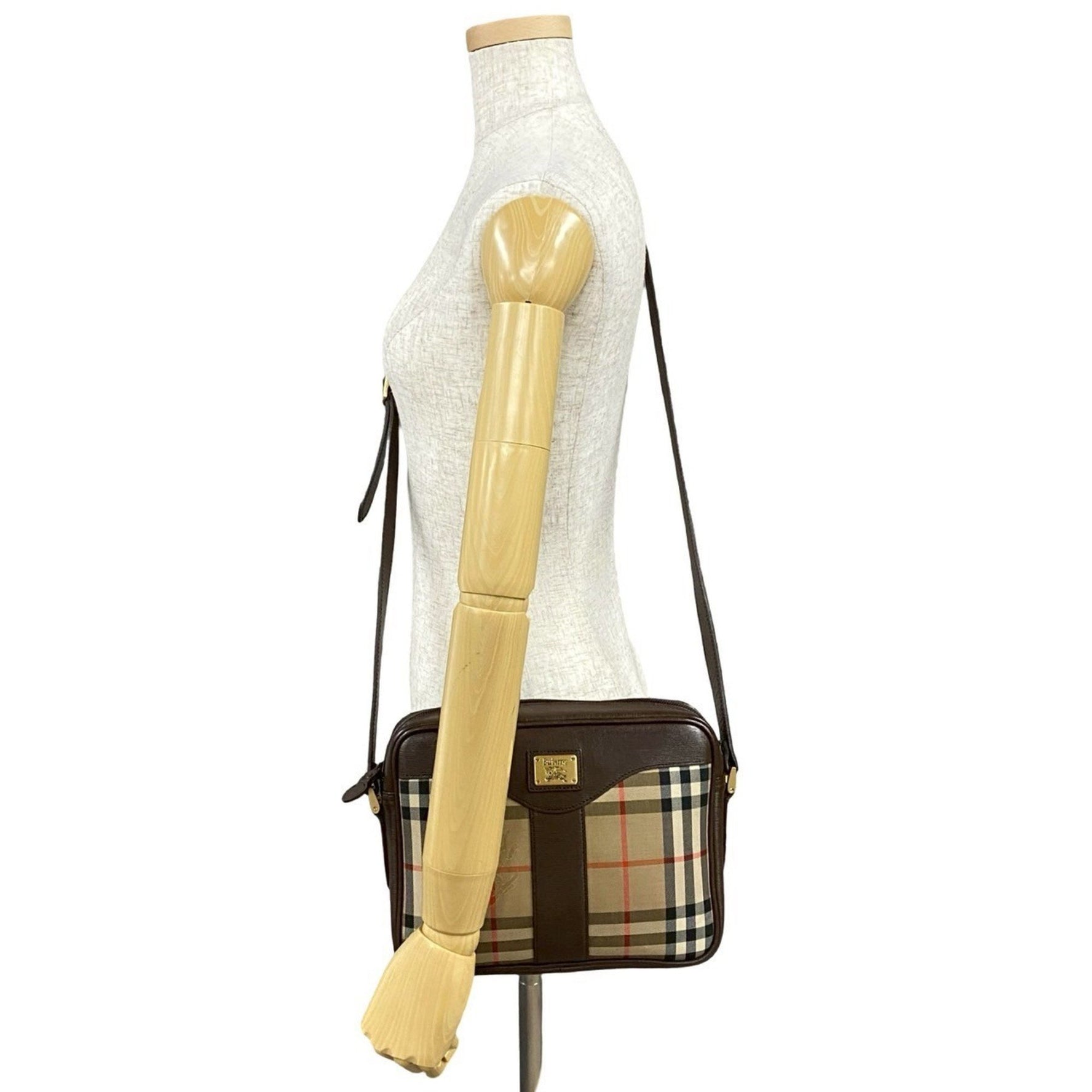 Burberry's Nova Check Shadow Horse logo hardware canvas and leather shoulder bag in