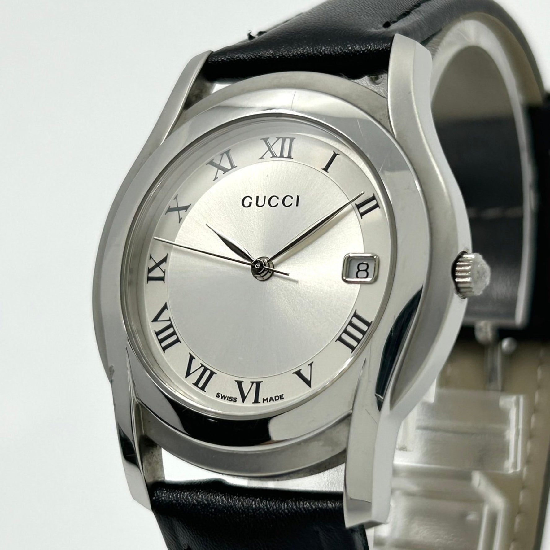Gucci 5500M Men's Analog Quartz Watch with Silver Dial, Roman Numerals, Date Display, and Leather Strap, Black (G1)