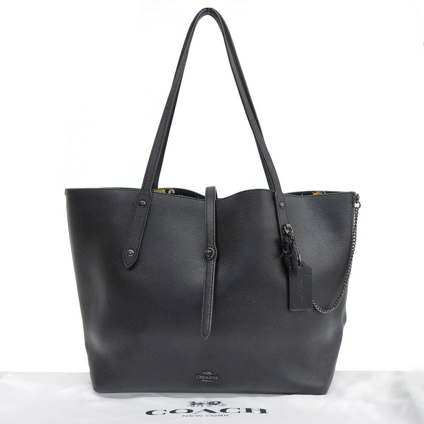 Like new Coach Market Tote Prairie leather with floral print.