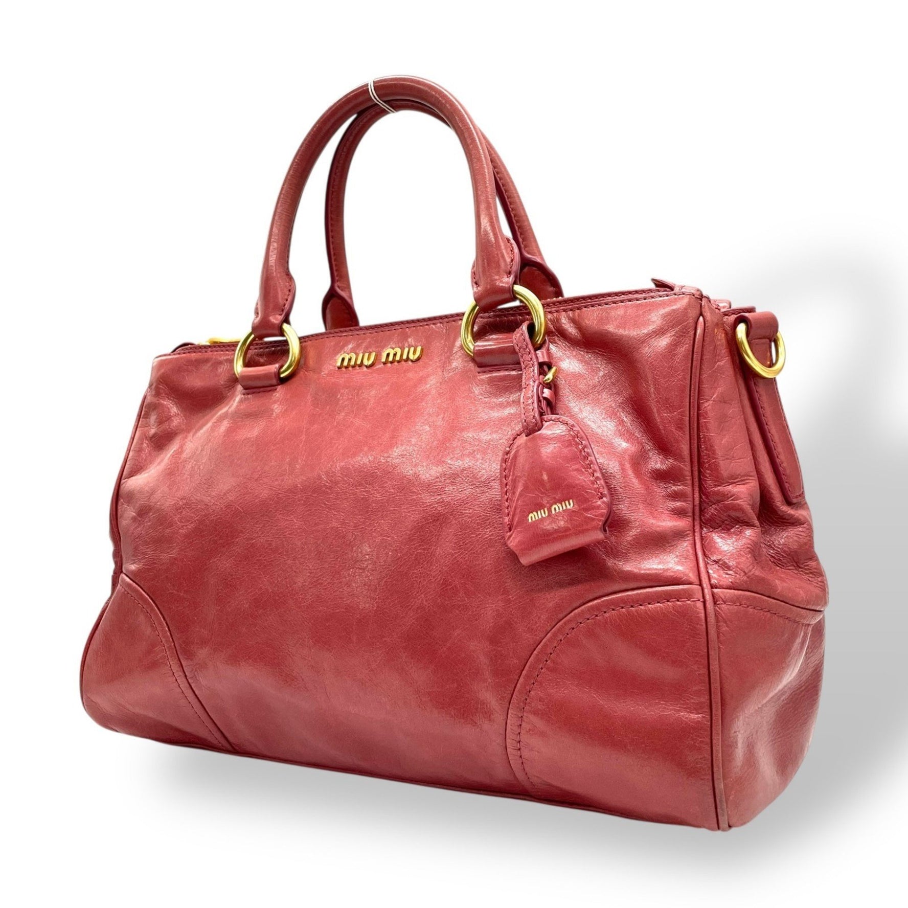 Miu Miu Miu VITELLO SHINE Red Tote Bag a leather handbag and tote bag.
